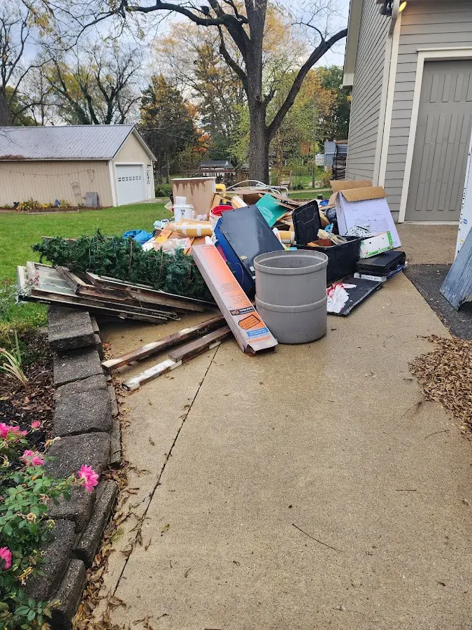 Dumpster being loaded with debris for 3 Yard Dumpster Rental in Winona